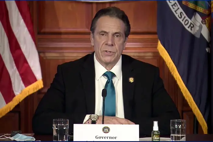 Governor Andrew Cuomo in a suit, talking at Friday's briefing.
